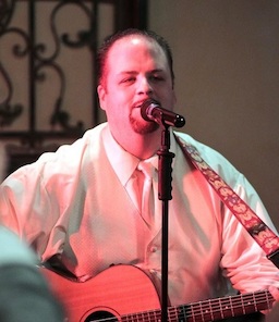 Dan Ward singing and playing the guitar at Tavola.