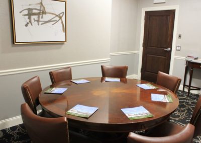 Eagle Room setup for meeting with round table.